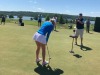 paige-putts-on-dance-floor-green